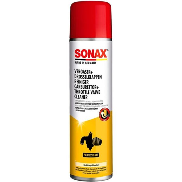 Spraying Sonax carburetor cleaner on engine part for grime removal